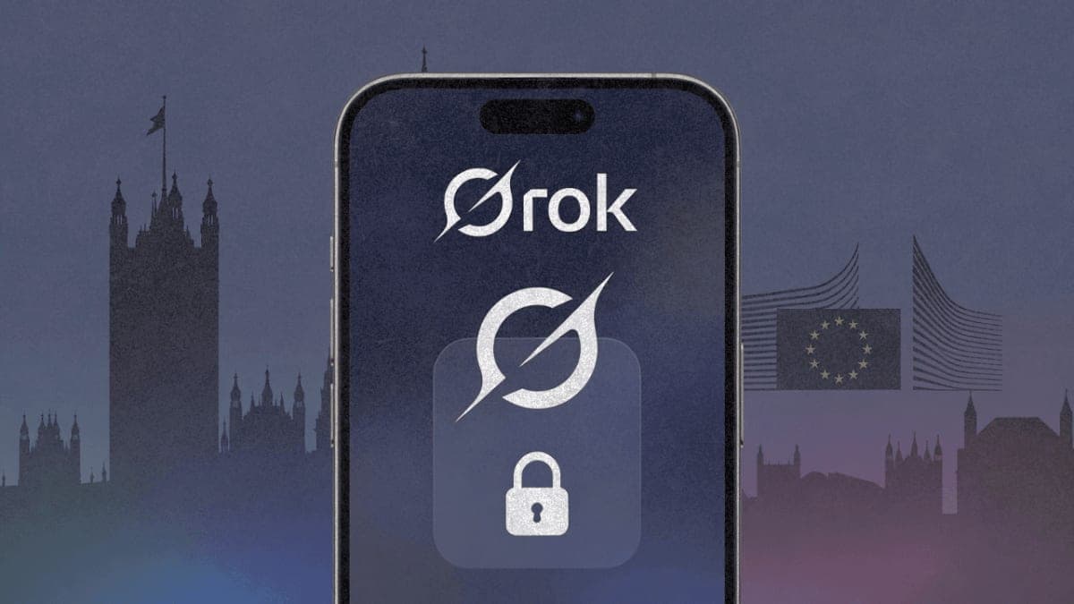 Smartphone displaying Grok logo with padlock symbol against dark gradient with regulatory building silhouettes