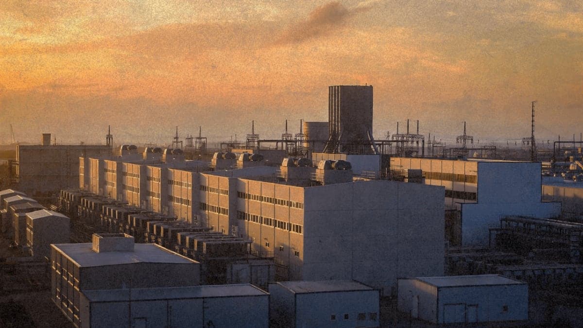 Data center facility with cooling infrastructure at dusk