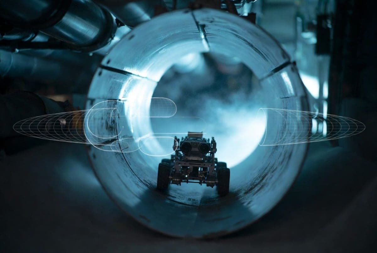 A small wheeled robot navigating inside a metal ventilation duct, illustrating low-power 3D mapping
